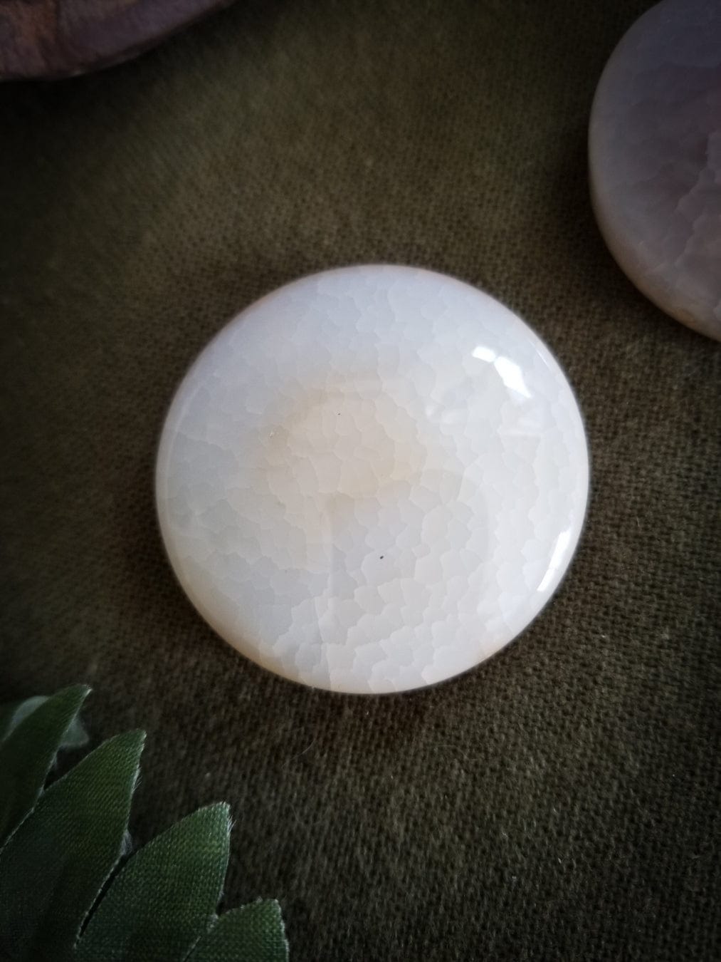 2 Flat Round Agate beads. Color - translucent with tones of white, pink, and pale yellow. Smooth with a cracked effect created by heat.