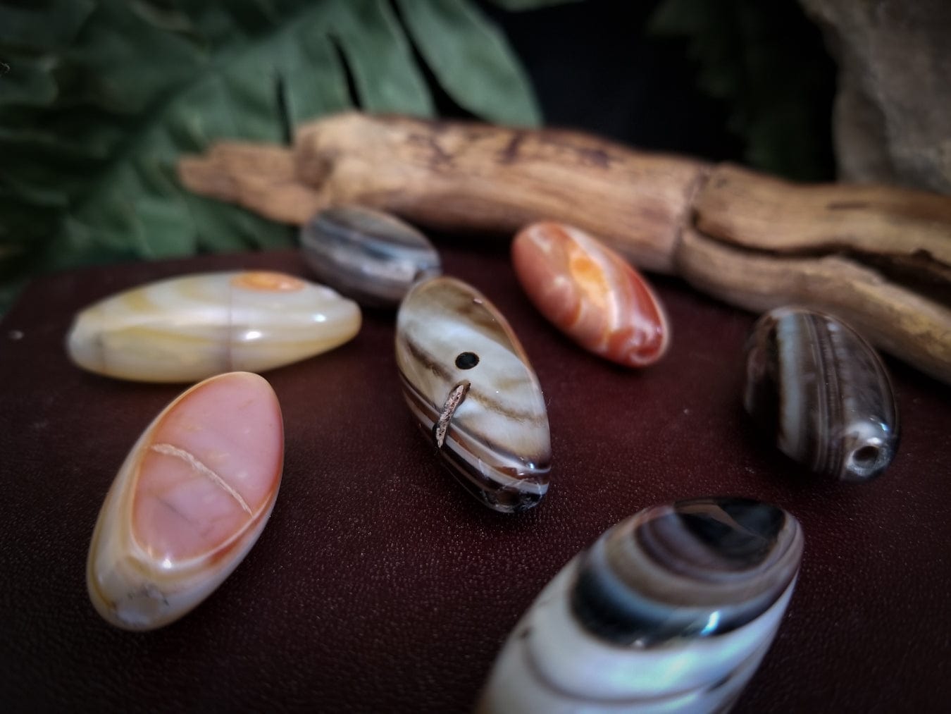 7 Smooth tube banded agate stone beads. Colors - red, white, and black bands.