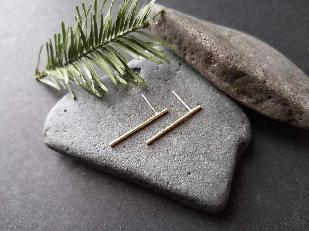Handmade brass bar studs with sterling silver posts. Brass bars measure 1 inch in length.