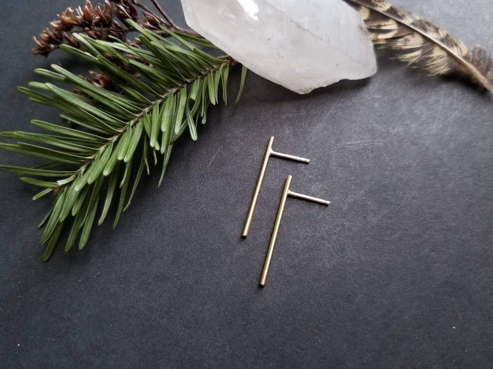 Handmade brass bar studs with sterling silver posts. Brass bars measure 1 inch in length.