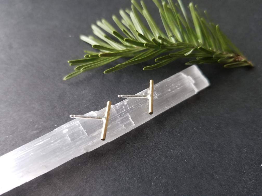 Handmade brass bar studs with sterling silver posts. Brass bars measure ½ inches in length.