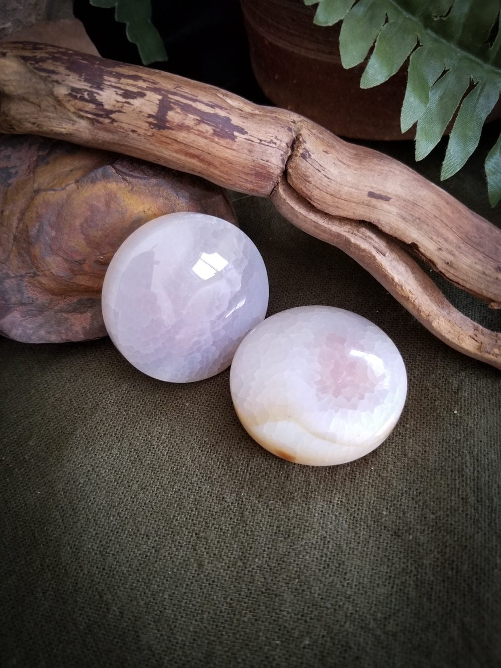 2 Flat Round Agate beads. Color - translucent with tones of white, pink, and pale yellow. Smooth with a cracked effect created by heat.