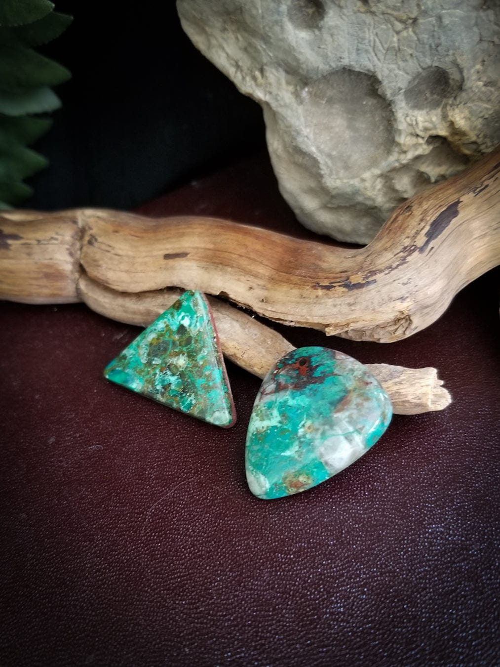 Chrysocolla triangle and teardrop shaped cabochons. Greens, turquoise, black, and reds