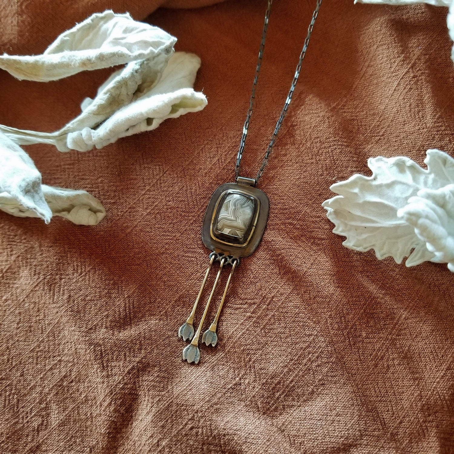 Snowdrop Necklace No. 1 - Cushion cut (rounded rectangle) Mexican Agate set in sterling silver and brass with 3 individual hand engraved snowdrop flowers hanging from brass fringe. All hanging from a sterling silver box chain. 