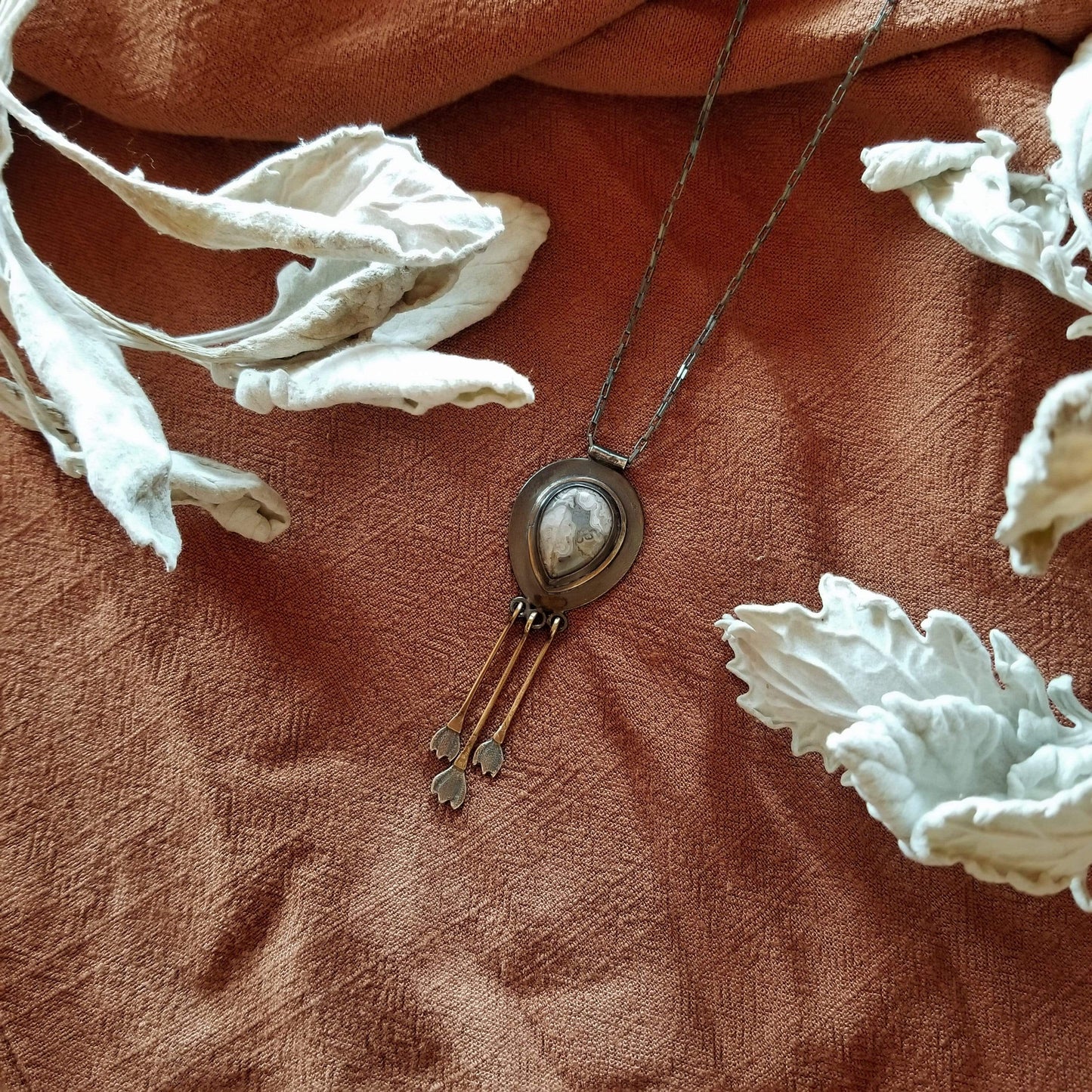 Snowdrop Necklace No. 2 - Tear drop Mexican Agate (white and grey colors) set in sterling silver and brass with 3 individual hand engraved snowdrop flowers hanging from brass fringe. All hanging from a sterling silver box chain.