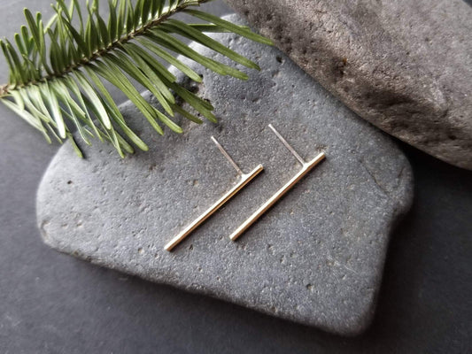 Handmade brass bar studs with sterling silver posts. Brass bars measure 1 inch in length. 