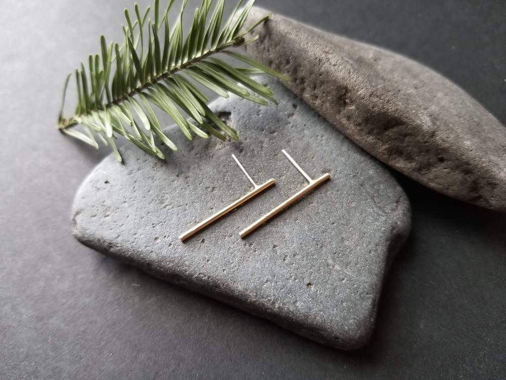 Handmade brass bar studs with sterling silver posts. Brass bars measure 1 inch in length. 