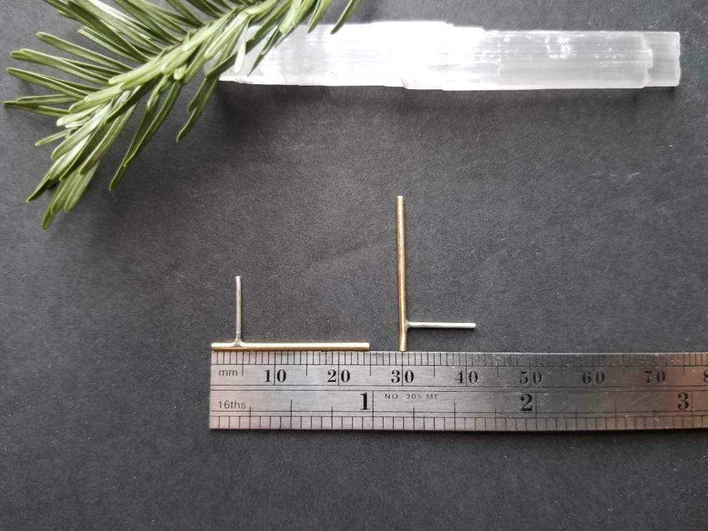 Showing measurements of the handmade brass bar studs with sterling silver posts. Brass bars measure 1 inches in length. 
