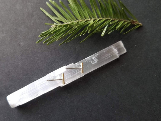 Handmade brass bar studs with sterling silver posts. Brass bars measure ¼ inches in length. 